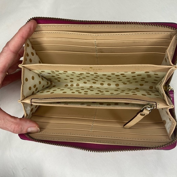 Leather Zip Around Wallet by Kate Spade in magenta.

Length: 7.75",  Height: 4" - Picture 6 of 6